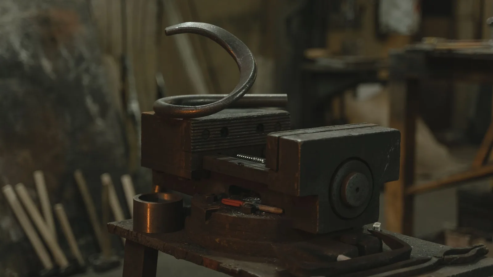 Close-up of metalwork equipment in an industrial workshop setting.