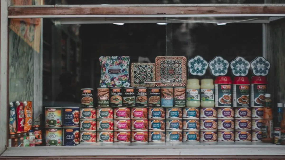 A vibrant selection of canned goods and condiments beautifully arranged in a store window.